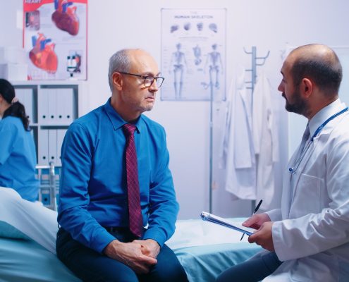 brain and body health, doctor talking to male patient